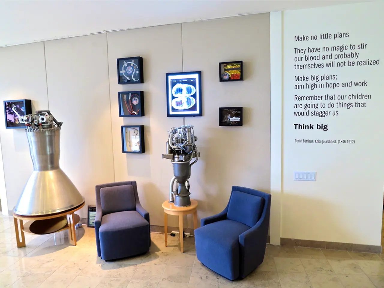 This image consists of two sofas. On the left, there is an object made up of metal. In the...