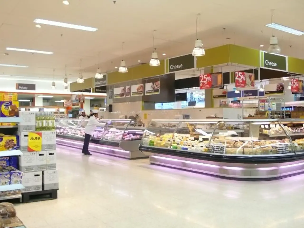 In this picture we can see a store here, we can see racks here, there are some bakery items present...