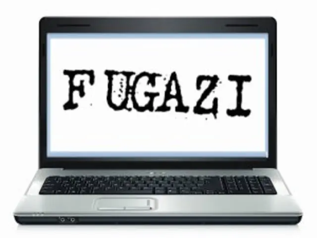 In the middle of the image there is a laptop on the white surface. Something is written on the...