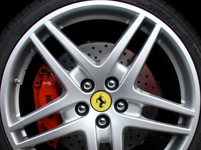 In this picture we can see a wheel of a vehicle.